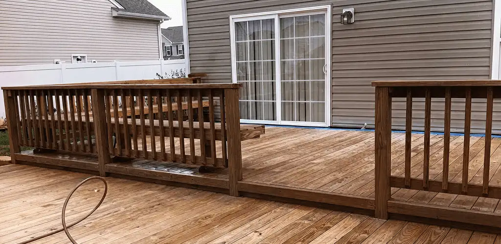 Deck sealing service protecting a backyard wood deck and railings in San Francisco, CA
