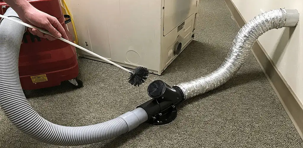 Dryer vent cleaning service removing lint from a dryer duct connection in San Francisco, CA